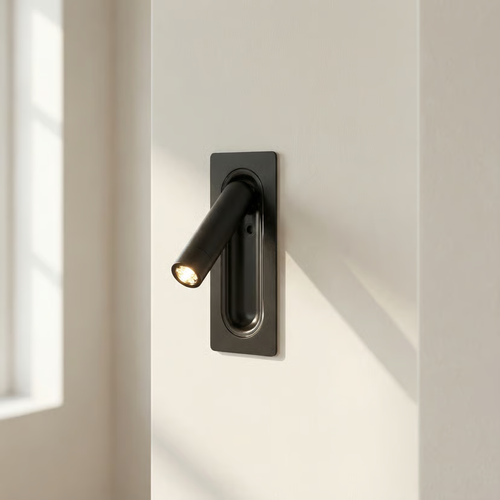 Modern black door handle on a white door with sunlight casting shadows.