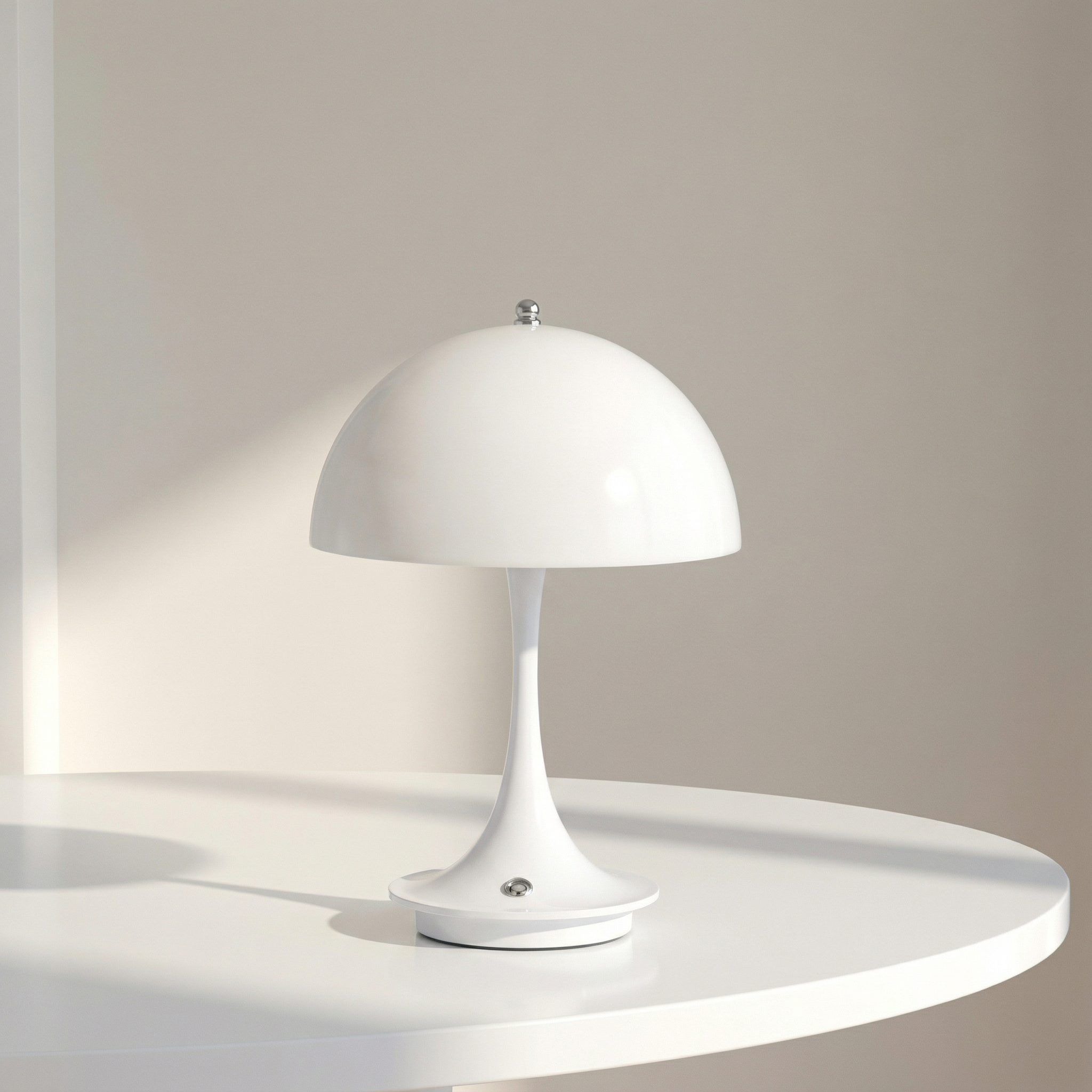 White table lamp on a round white surface with a neutral background